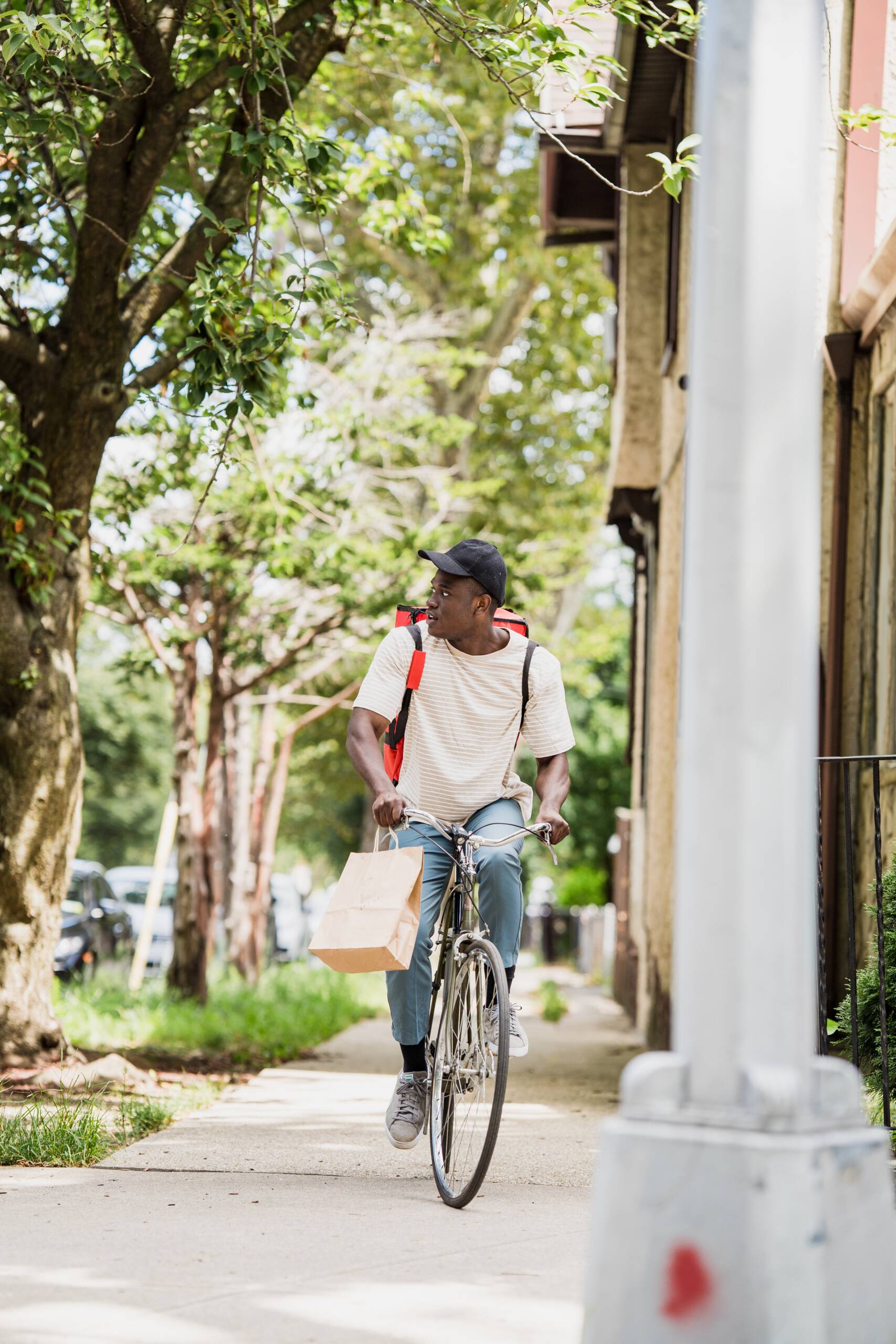 riding bicycle on sidewalk