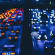 Misery depicted in blurry traffic lights on a crowded rush hour freeway.