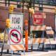 A thicket of discouraging road signs blocking roadway.