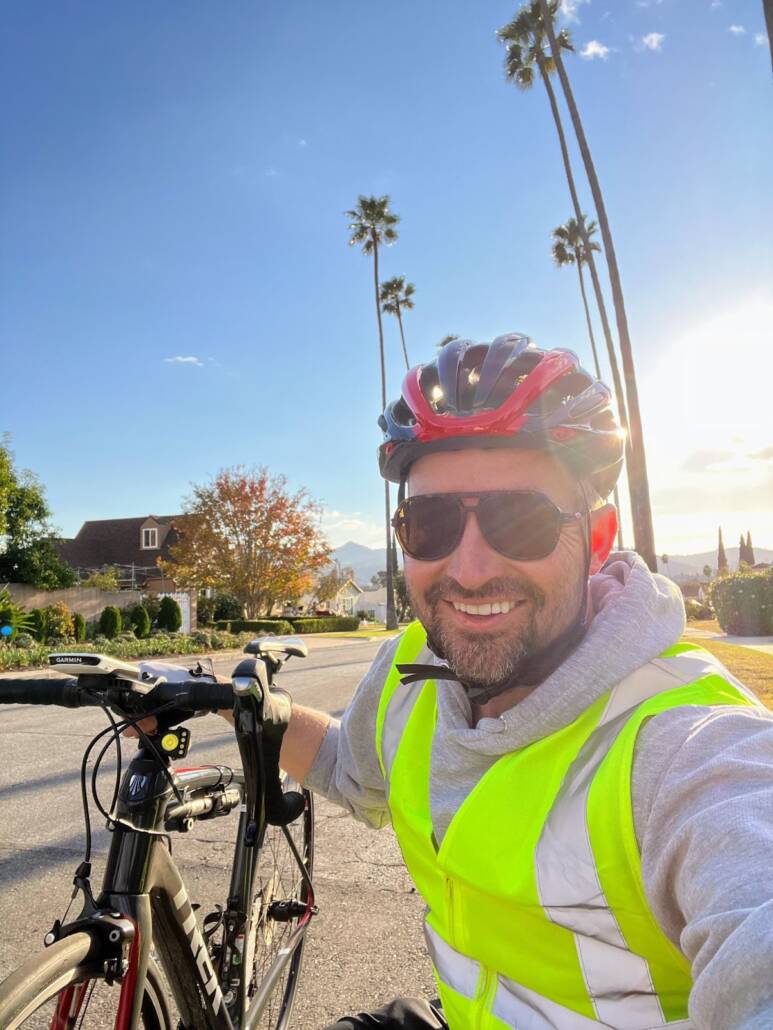 Individual Giving Manager Andrew Wright alongside his bike in the hills above Glendale.