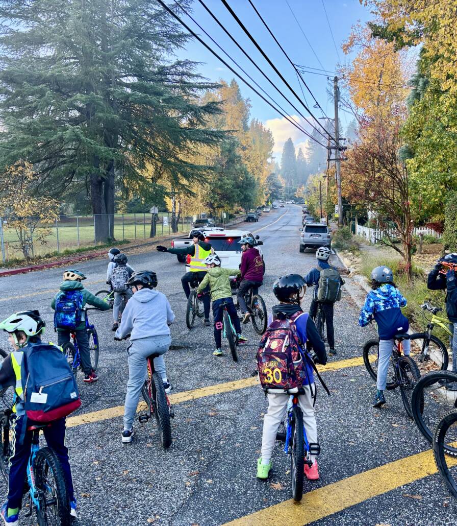 A bike bus making a safe turn in Nevada City. 