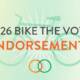 Graphic with the text “2026 Bike the Vote Endorsements” over a pale green background, featuring a large translucent bicycle, radiating lines, and two interlocking orange and green circles.